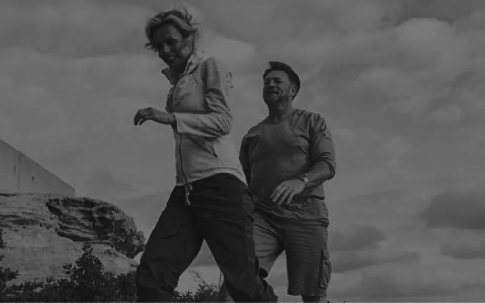 Active mature couple walking together